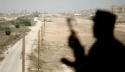 epa06209627 (FILE) - A Hamas security guards is silhouetted while standing guard near the border between Egypt and Gaza Strip in Rafah, southern Gaza Strip, 17 August 2017 (reissued 17 September 2017). Palestinian Islamist Hamas group said on 17 September 2017 it has dissolved its administration that runs Gaza and agrees to hold general elections in order to end a long-running feud with President Mahmoud Abbas's Fatah movement. EPA/HASSAN ALI