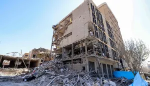 TOPSHOT - The exposed interior of a heavily-damaged building is pictured near Ferdowsi square in Tehran on March 3, 2026. The United States and Israel started striking Iran on February 28, killing Iran's supreme leader and top military leaders, and prompting authorities to retaliate with strikes on Israel and across the Gulf. (Photo by ATTA KENARE/AFP)