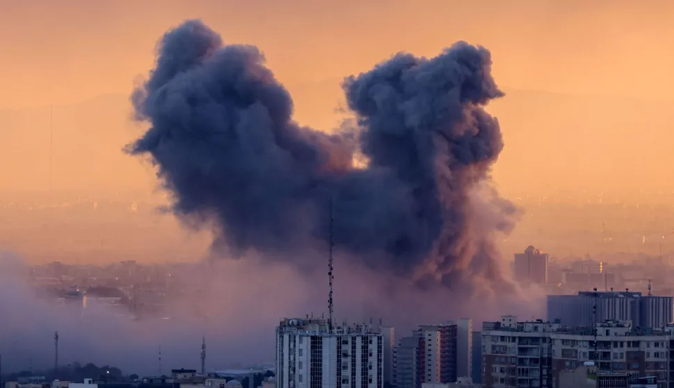 TOPSHOT - A plume of smoke rises after a strike on the Iranian capital Tehran, on March 3, 2026. Iran stepped up its attacks on economic targets and US missions across the Middle East on Tuesday as the US president warned it was "too late" for the Islamic republic to seek talks to escape the war. The United States and Israel launched strikes against Iran on February 28, with the killing of Iran's supreme leader and the Islamic republic retaliated with barrages of missiles at Gulf states and Israel. (Photo by ATTA KENARE/AFP)