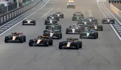epa12576738 Red Bull Racing driver Max Verstappen of Netherlands (botom R) leads the pack into turn 1 at from the start of in the Formula One Abu Dhabi Grand Prix at the Yas Marina Circuit racetrack in Abu Dhabi, United Arab Emirates, 07 December 2025. EPA/ALI HAIDER
