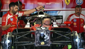 Mechanics work on Ferrari's British driver Lewis Hamilton's car ahead of the Formula One Australian Grand Prix at Albert Park in Melbourne on March 5, 2026. (Photo by Paul Crock/AFP)/-- IMAGE RESTRICTED TO EDITORIAL USE - STRICTLY NO COMMERCIAL USE --