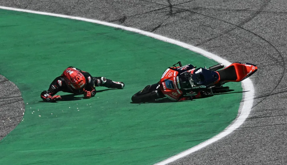 MT Helmets-MSi's Japanese rider Ryusei Yamanaka crashes during the Moto3 race at the MotoGP Thailand Grand Prix at the Buriram International Circuit in Buriram on March 1, 2026. (Photo by Lillian SUWANRUMPHA/AFP)
