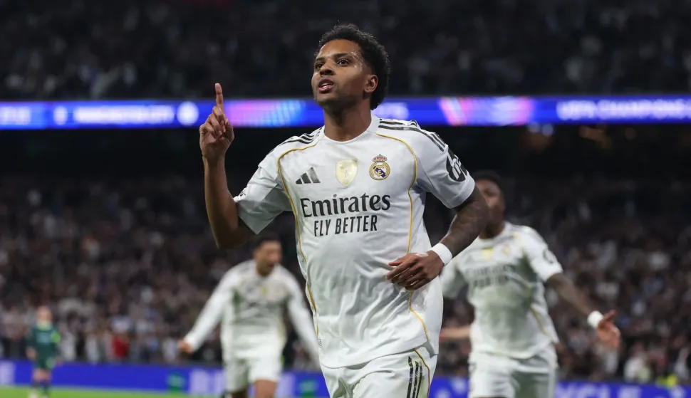 (FILES) Real Madrid's Brazilian forward #11 Rodrygo celebrates scoring his team's first goal during the UEFA Champions League league phase day 6 football match between Real Madrid CF and Manchester City at Santiago Bernabeu Stadium in Madrid on December 10, 2025. Real Madrid said on March 3, 2026 Rodrygo has suffered a severe knee injury, and it is expected to keep him out of the 2026 World Cup with Brazil. (Photo by Pierre-Philippe MARCOU/AFP)