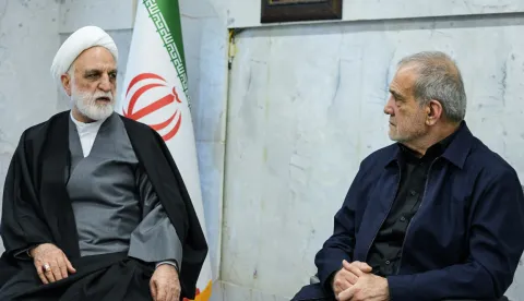 A handout photo made available by the state television station, Islamic Republic of Iran Broadcasting News (IRIBNEWS) on March 2, 2026, show the second meeting of the Interim Leadership Council attended by Judiciary Chief Gholamhossein Mohseni Ejei (L) and President Masoud Pezhakian (R), in Tehran. Iran's supreme leader since 1989 and sworn enemy of the West, was killed in the opening salvo of a massive US and Israeli attack, sparking a new wave of retaliatory missile strikes from Tehran on March 1. (Photo by Handout/AFP)/RESTRICTED TO EDITORIAL USE - MANDATORY CREDIT "AFP PHOTO/Islamic Republic of Iran Broadcasting News (IRIBNEWS)" - HANDOUT - NO MARKETING NO ADVERTISING CAMPAIGNS - DISTRIBUTED AS A SERVICE TO CLIENTS