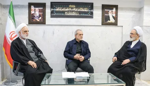 TOPSHOT - A handout photo made available by the state television station, Islamic Republic of Iran Broadcasting News (IRIBNEWS) on March 2, 2026, show The second meeting of the Interim Leadership Council attended by President Masoud Pezhakian (C) Judiciary Chief Gholamhossein Mohseni Ejei (L) and Alireza Aarafi (R), a member of the Guardian Council's jurist, in Tehran. The United States and Israel launched strikes against Iran, killing the Iranian supreme leader, with the Islamic republic retaliating with barrages of missiles at Gulf states and Israel on February 28, 2026. (Photo by Handout/IRIBNEWS/AFP)/RESTRICTED TO EDITORIAL USE - MANDATORY CREDIT "AFP PHOTO/Islamic Republic of Iran Broadcasting News (IRIBNEWS)" - HANDOUT - NO MARKETING NO ADVERTISING CAMPAIGNS - DISTRIBUTED AS A SERVICE TO CLIENTS