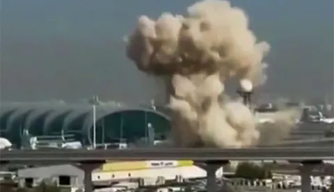 TOPSHOT - This video grab taken from UGC images posted on social media on March 7, 2026 shows smoke rising from the Dubai International Airport. Dubai airport, the world's busiest for international traffic, suspended operations on March 7 before partially resuming services, after an air defence interception in the area during attacks from Iran. (Photo by various sources/AFP)/RESTRICTED TO EDITORIAL USE - MANDATORY CREDIT AFP - SOURCE: UGC/UNKNOWN - DISTRIBUTED AS A SERVICE TO CLIENTS - NO RESALE -