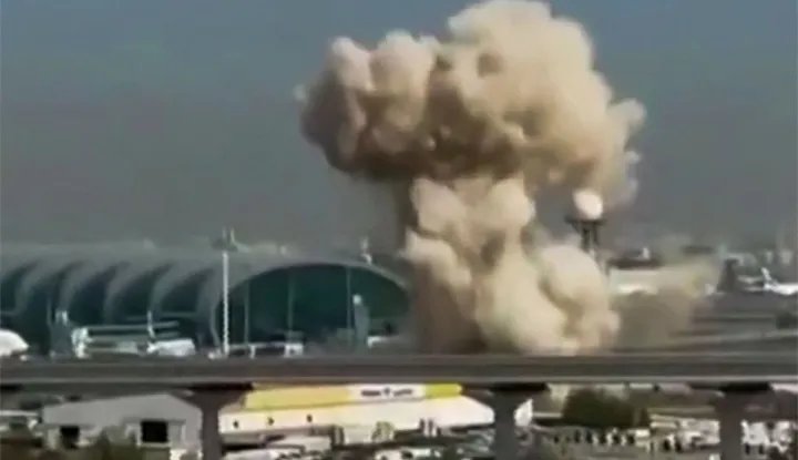 TOPSHOT - This video grab taken from UGC images posted on social media on March 7, 2026 shows smoke rising from the Dubai International Airport. Dubai airport, the world's busiest for international traffic, suspended operations on March 7 before partially resuming services, after an air defence interception in the area during attacks from Iran. (Photo by various sources/AFP)/RESTRICTED TO EDITORIAL USE - MANDATORY CREDIT AFP - SOURCE: UGC/UNKNOWN - DISTRIBUTED AS A SERVICE TO CLIENTS - NO RESALE -