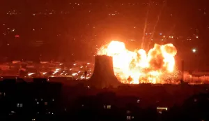 TOPSHOT - An explosion erupts following strikes near Azadi Tower close to Mehrabad International Airport in Tehran on March 7, 2026. The United States and Israel launched strikes against Iran on February 28, sparking swift retaliation by the Islamic republic which responded with missile attacks across the region. The war has dragged in global powers, upended the world's energy and transport sectors, and brought chaos to even usually peaceful areas of the volatile region. (Photo by ATTA KENARE/AFP)