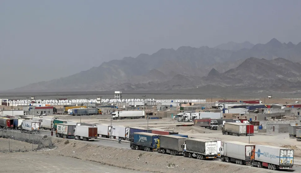 Cargo trucks wait to enter the Pakistan-Iran border crossing at Taftan, Balochistan province on March 2, 2026 amid ongoing US-Israel strikes on Iran. (Photo by Banaras KHAN/AFP)