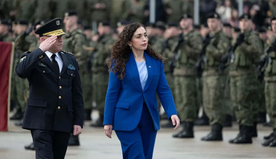 Kosovo's President Vjosa Osmani (R) flanked by the Commander of the Kosovo Security Force (KSF) Bashkim Jashari review troops as they take part in a ceremony marking the 28th anniversary of the killing of Kosovo Liberation Army (KLA) founding member and commander Adem Jashari, in Pristina on March 5, 2026. Adem Jashari, seen as the "father of the KLA", was among 45 members of his family killed by Serb security forces in the village of Prekaz some 50 km west of the Kosovo capital Pristina, sparking a full-blown rebel insurgency. (Photo by Armend NIMANI/AFP)