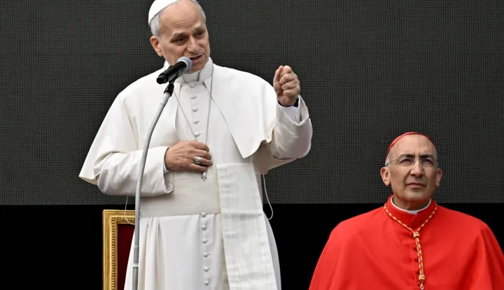 Pope Leo XIV (L) flanked by cardinal Baldassare Reina delivers a speech during his visit to the Parish of Santa Maria della Presentazione in Rome on March 8, 2026. (Photo by Tiziana FABI/AFP)