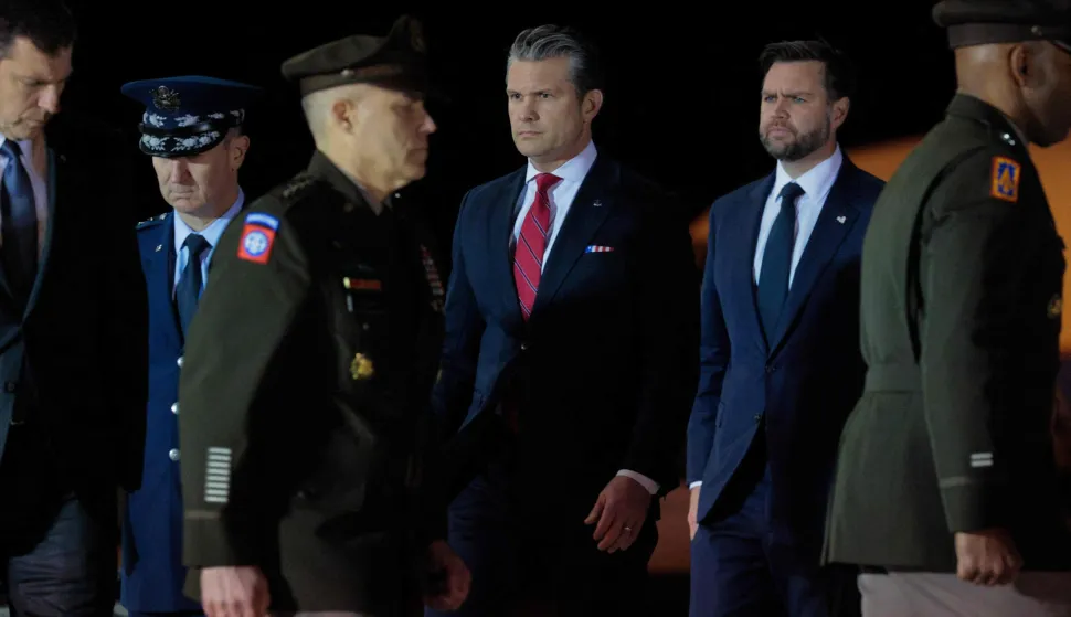 DOVER, DELAWARE - MARCH 09: Chairman of the Joint Chiefs of Staff Gen. Dan Caine (2nd L), U.S. Secretary of War Pete Hegseth (4th L) and Vice President JD Vance (5th L) participate in the dignified transfer of U.S. Army Sgt. Benjamin N. Pennington at Dover Air Force Base on March 9, 2026 in Dover, Delaware. Sgt. Pennington died of injuries sustained from an Iranian attack on Prince Sultan Air Base in Saudi Arabia on March 1, 2026. Chip Somodevilla/Getty Images/AFP (Photo by CHIP SOMODEVILLA/GETTY IMAGES NORTH AMERICA/Getty Images via AFP)