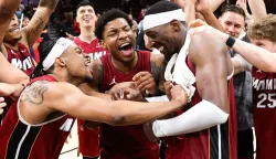MIAMI, FLORIDA - MARCH 10: Bam Adebayo #13 of the Miami Heat celebrates with teammates after a 150-129 win against the Washington Wizards at Kaseya Center on March 10, 2026 in Miami, Florida. Adebayo passed Kobe Bryant for the second most points scored in an NBA game with 83. NOTE TO USER: User expressly acknowledges and agrees that, by downloading and or using this photograph, User is consenting to the terms and conditions of the Getty Images License Agreement. Megan Briggs/Getty Images/AFP (Photo by Megan Briggs/GETTY IMAGES NORTH AMERICA/Getty Images via AFP)