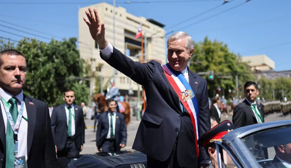 Chile's new President Jose Antonio Kast waves from the presidential convertible car after his inauguration ceremony in Valparaiso, Chile, on March 11, 2026. Chile's most right-wing president in over three decades, Jose Antonio Kast, takes office on March 11, 2026, on a promise to tackle surging rates of violent crime and carry out mass migrant deportations. (Photo by Javier TORRES/AFP)