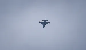 A United Arab Emirates Air Force F-16 fighter jet flies over Dubai on March 11, 2026. The Gulf countries have long been seen as islands of stability in the Middle East, but the war in the region could threaten their prosperity, analysts said, pointing to risks to their revenues and reputations as business havens. (Photo by AFP)/Attention editors: AFP covers the war in the Middle East through its extensive regional network, including bureaus in Tehran, Jerusalem, and several neighboring countries. Since the start of the conflict, journalists have been working under increasingly restrictive conditions. Authorities in several countries have limited reporters' movements, photo and live video coverage from sensitive locations. Some governments and armed groups have banned images of missile or drone strikes and other security-related sites./