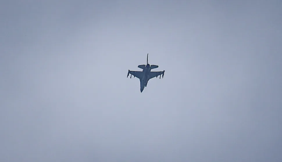 A United Arab Emirates Air Force F-16 fighter jet flies over Dubai on March 11, 2026. The Gulf countries have long been seen as islands of stability in the Middle East, but the war in the region could threaten their prosperity, analysts said, pointing to risks to their revenues and reputations as business havens. (Photo by AFP)/Attention editors: AFP covers the war in the Middle East through its extensive regional network, including bureaus in Tehran, Jerusalem, and several neighboring countries. Since the start of the conflict, journalists have been working under increasingly restrictive conditions. Authorities in several countries have limited reporters' movements, photo and live video coverage from sensitive locations. Some governments and armed groups have banned images of missile or drone strikes and other security-related sites./