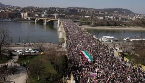 An overview shows people attending a "Peace March" in support of the government of Prime Minister's FIDESZ on the Margaret Bridge in Budapest, Hungary on March 15, 2026, on the 178th anniversary of the Hungarian Revolution and War of Independence of 1848-1849. The 1848-1849 revolution in the Kingdom of Hungary grew into a war for independence from the Austrian Empire, ruled by the Habsburg dynasty. (Photo by Peter Kohalmi/AFP)