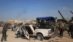 Palestinians inspect the site of an Israeli strike that targeted a police vehicle in Zawaida in the central Gaza Strip on March 15, 2026. The Al-Aqsa hospital in the central city of Deir al-Balah said in a statement that "eight martyrs arrived as a result of the targeting of a police vehicle in the town of Zawaida in the central Gaza Strip". Violence has continued in the war-shattered Palestinian territory despite a ceasefire which came into effect on October 10, with both Israel and Hamas regularly accusing the other of violations. (Photo by Eyad Baba/AFP)