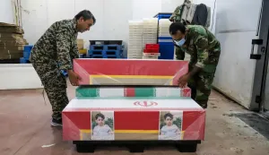 (FILES) In this picture obtained from Iran's ISNA news agency, mourners prepare the coffins of children who were killed in a reported strike on a primary school in Iran?s Hormozgan province for a funeral in Minab on March 3, 2026. The United Nations rights chief called on March 6, 2026, for answers after a deadly strike on an Iranian elementary school, as a media investigation concluded the United States was most likely responsible. On the first day of the war last February 28, 2026, a strike hit an elementary school in the southern Iranian town of Minab and killed at least 150 people, say Iranian officials. (Photo by AMIRHOSSEIN KHORGOOEI/ISNA/AFP)
