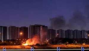 CORRECTION/A fire burns outside the grounds of the US Embassy headquarters in Baghdad's fortified "Green Zone" on March 17, 2026 following a drone and rocket attack according to security officials. The strikes came hours after air defences thwarted a rocket attack at the embassy and a drone sparked a fire at a luxury hotel frequented by foreign diplomats in the Green Zone. Iraq was drawn into the Middle East war after having long been a proxy battleground between the US and Iran, with strikes targeting Iran-backed groups that have claimed daily attacks on US interests in Iraq and across the region. (Photo by AHMAD AL-RUBAYE/AFP)/?The erroneous mention[s] appearing in the metadata of this photo by AHMAD AL-RUBAYE has been modified in AFP systems in the following manner: [outside the grounds] instead of [on the grounds]. Please immediately remove the erroneous mention[s] from all your online services and delete it (them) from your servers. If you have been authorized by AFP to distribute it (them) to third parties, please ensure that the same actions are carried out by them. Failure to promptly comply with these instructions will entail liability on your part for any continued or post notification usage. Therefore we thank you very much for all your attention and prompt action. We are sorry for the inconvenience this notification may cause and remain at your disposal for any further information you may require.?