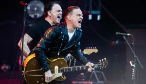 epa11444304 Canadian singer-songwriter and musician Bryan Adams (R) performs at the Tinderbox music festival in Odense, Denmark, 28 June 2024 (issued 29 June 2024). The festival runs from 27 to 29 June 2024. EPA/HELLE ARENSBAK DENMARK OUT