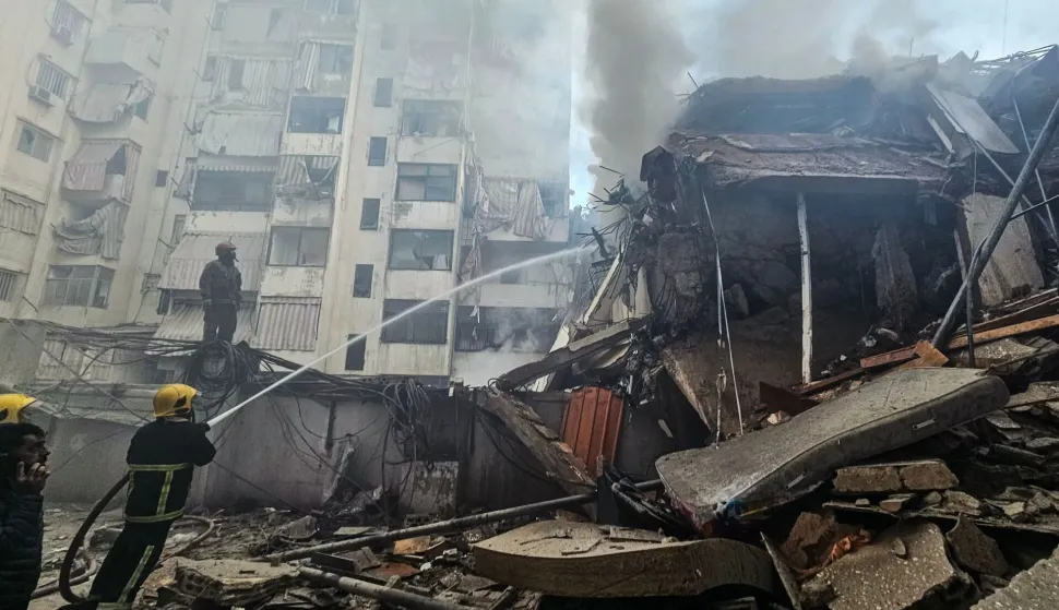 Firefighters extinguish a fire that swept through the site of an Israeli airstrike targeting Beirut?s southern suburbs, in the al-Kafaat neighborhood, on March 17, 2026. Israel launched a wave of strikes on Tehran and Beirut on March 17, while attacks in Baghdad drew neighbouring Iraq deeper into the Middle East war that has sparked economic turmoil across the globe. (Photo by AFP)