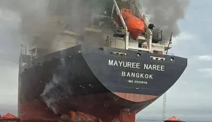 TOPSHOT - This handout photo taken on March 11, 2026 and released by the Royal Thai Navy shows smoke rising from the Thai bulk carrier 'Mayuree Naree' near the Strait of Hormuz after an attack. A Thai bulk carrier travelling in the crucial Strait of Hormuz was attacked March 11, with 20 crew members rescued so far, the Thai navy said. (Photo by Handout/ROYAL THAI NAVY/AFP)/-----EDITORS NOTE --- RESTRICTED TO EDITORIAL USE - MANDATORY CREDIT "AFP PHOTO/ROYAL THAI NAVY " - NO MARKETING - NO ADVERTISING CAMPAIGNS - DISTRIBUTED AS A SERVICE TO CLIENTS -