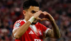 Bayern Munich's Colombian forward #14 Luis Diaz celebrates scoring the 4-0 goal with his teammates during the UEFA Champions League, Round of 16 2nd-leg football match between FC Bayern Munich and Atalanta in Munich, southern Germany, on March 18, 2026. (Photo by Alexandra BEIER/AFP)