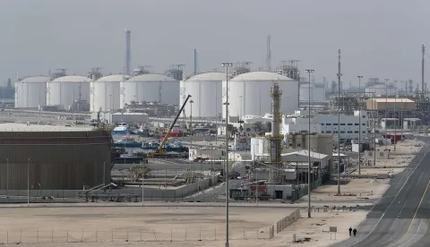 TOPSHOT - (FILES) This picture shows the Ras Laffan Industrial City, Qatar's principal site for production of liquefied natural gas and gas-to-liquid, administrated by Qatar Petroleum, some 80 kilometers (50 miles) north of the capital Doha, on February 6, 2017. Tehran on March 19, 2026, has carried out a series of attacks on Gulf energy sites, including on Qatar's huge Ras Laffan LNG facility, in retaliation for an Israeli strike on Iran's South Pars gas field -- part of the world's largest natural gas reservoir. (Photo by KARIM JAAFAR/AFP)