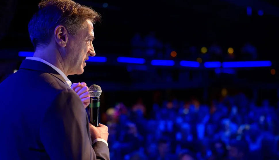 Slovenia?s Prime Minister Robert Golob (L) addresses the supporters of Gibanje Svoboda (The Freedom Movement) after the General Elections results are released in Ljubljana, Slovenia, on March 22, 2026. Slovenia's incumbent liberal Prime Minister Robert Golob on March 22, 2026 claimed victory in parliamentary elections, even as official results showed a neck and neck finish with the conservatives. (Photo by Jure Makovec/AFP)