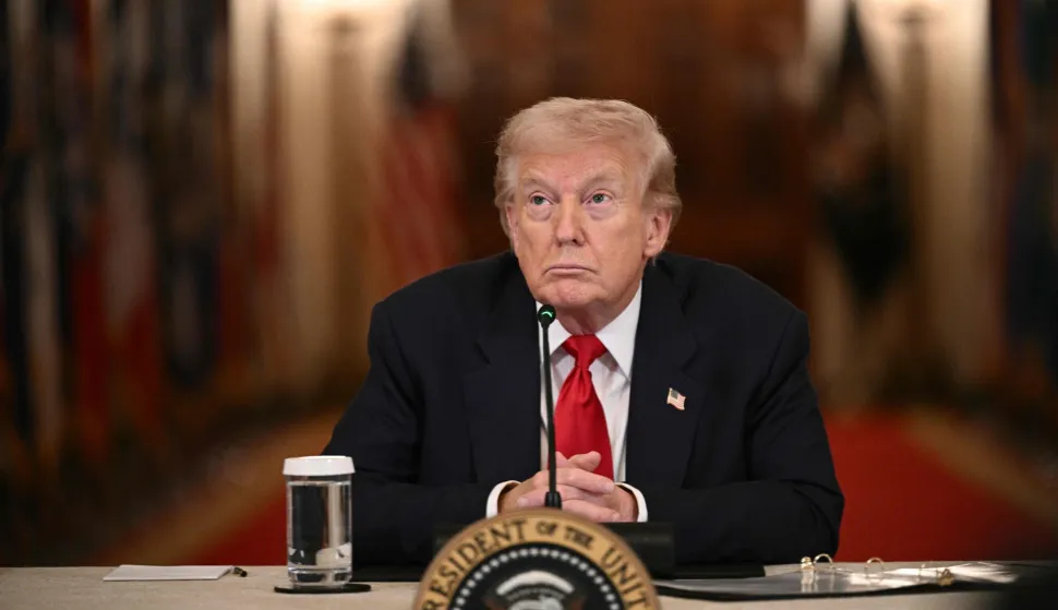 US President Donald Trump listens during a roundtable to "save college sports" in the East Room of the White House in Washington, DC, on March 6, 2026. (Photo by Brendan SMIALOWSKI/AFP)