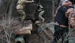 This handout photograph taken and released by the press service of the 65th Separate Mechanized Brigade on March 18, 2026 shows a Ukrainian artilleryman preparing their 155mm self-propelled ?-109 howitzer on the front line in the Zaporizhzhia region, amid the Russian invasion of Ukraine. (Photo by Andriy Andriyenko/65th Mechanized Brigade of Ukrainian Armed Forces/AFP)