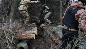 This handout photograph taken and released by the press service of the 65th Separate Mechanized Brigade on March 18, 2026 shows a Ukrainian artilleryman preparing their 155mm self-propelled ?-109 howitzer on the front line in the Zaporizhzhia region, amid the Russian invasion of Ukraine. (Photo by Andriy Andriyenko/65th Mechanized Brigade of Ukrainian Armed Forces/AFP)