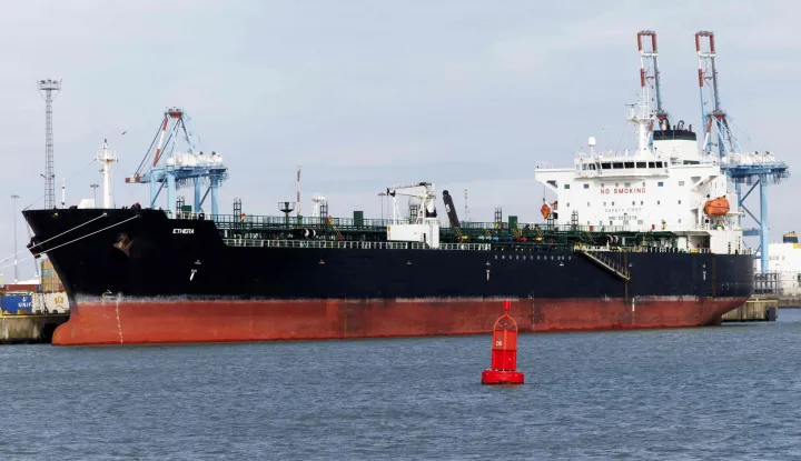 Oil tanker Ethera, part of the "shadow fleet" Russia uses to circumvent Western sanctions over the war in Ukraine, is docked at the naval base in Zeebrugge, northern Belgium, after it was boarded and seized by Belgium's special forces, on March 1, 2026. The tanker flew the flag of Guinea, but an on-board inspection confirmed suspicion that it was sailing under a false flag, Belgian prosecutors said. French President confirmed on X that French naval forces assisted in the operation, calling it a "major blow" to Russia's so-called "shadow fleet". (Photo by NICOLAS MAETERLINCK/Belga/AFP)/Belgium OUT