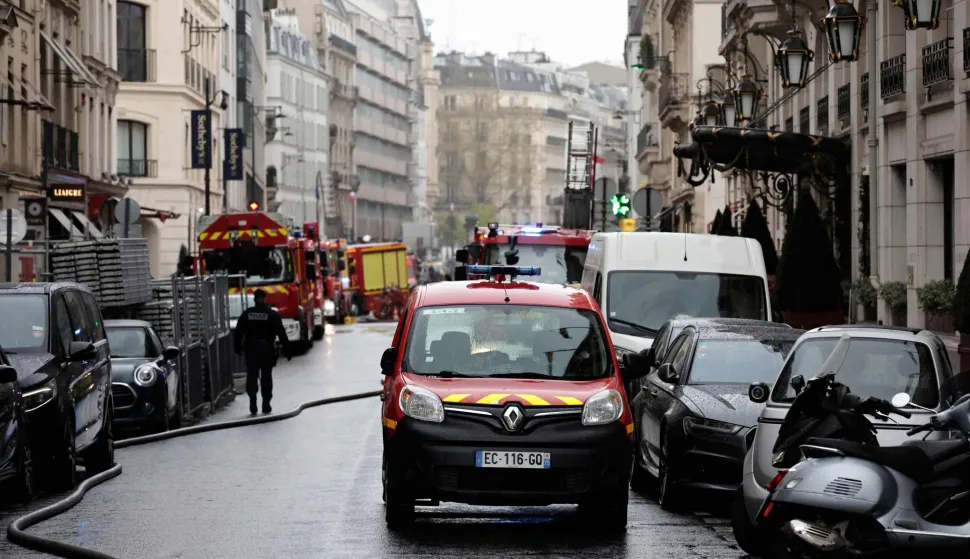 Firefighters work on the site of the Brisol Hotel where a "fairly large" fire broke out in the basement of the Hotel in Paris on March 25, 2026. Around 100 firefighters are on site to tackle this ?fairly large ongoing fire?, the Paris Fire Brigade said, confirming a report by Europe 1. Three people have suffered minor injuries, it added. Located on Rue du Faubourg Saint-Honore, not far from the Elysee Palace, the Bristol is a luxury hotel owned by the German multinational Oetker. (Photo by STEPHANE DE SAKUTIN/AFP)