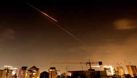 Rocket trails are seen in the sky above the Israeli coastal city of Netanya amid a fresh barrage of Iranian missile attacks late on March 27, 2026. Emergency responders said a man was killed in Israel on March 28 after the Israeli military reported missiles fired from Iran. (Photo by JACK GUEZ/AFP)/