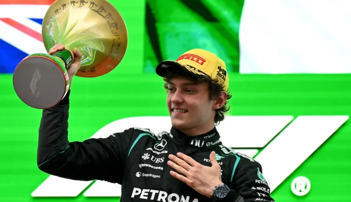 Winner Mercedes' Italian driver Kimi Antonelli celebrates on the podium after the Formula One Chinese Grand Prix at the Shanghai International Circuit in Shanghai on March 15, 2026. (Photo by Greg Baker/AFP)