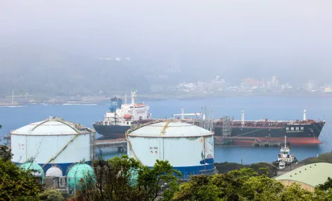 The oil products tanker Chang Hang Feng Cai, which is operated by a Chinese shipping company, is docked beside the LPG (liquefied petroleum gas) supply and distribution service center area at Shen?ao Port in New Taipei City on March 18, 2026. Oil prices sank on March 18 after Iraq said it had resumed exports through Turkey, avoiding the effectively closed Strait of Hormuz, while equities rose following another tech-led advance on Wall Street. (Photo by I-Hwa Cheng/AFP)