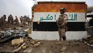 Iraqi soldiers inspect the site of the health center in the Habbaniyah military base, which was targeted by a US-Israeli airstrike, in Habbaniyah, west of Baghdad on March 26, 2026. Iraq announced on March 25 that it will file a complaint with the UN Security Council regarding the attacks targeting its territory since the start of the war, hours after seven soldiers were killed in an attack on their position in the west of the country. (Photo by AHMAD AL-RUBAYE/AFP)