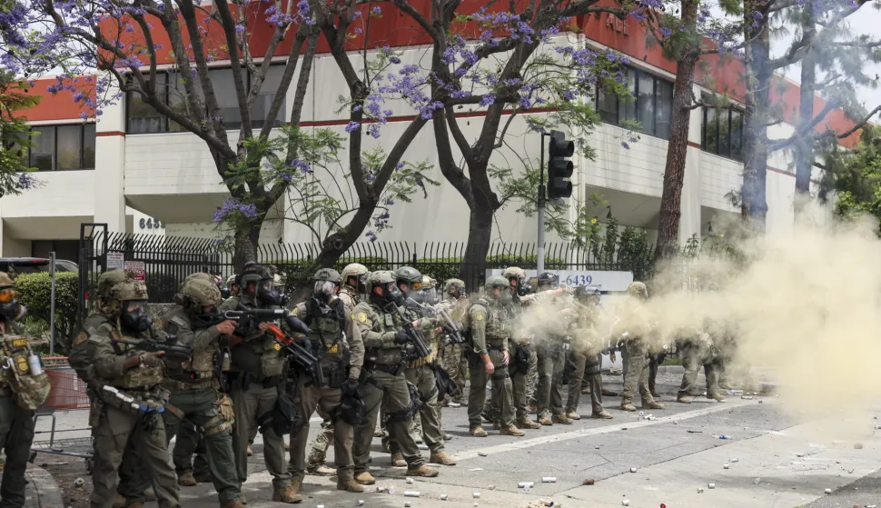 epa12163076 Federal agents fire flash-bang smoke grenades at protestors near a Home Depot after a raid was conducted by Immigration and Customs Enforcement (ICE) in Paramount, California, USA, 07 June 2025. This comes the day after federal immigration authorities arrested more than 40 people across Los Angeles, as protesters gathered outside a federal detention center. EPA/ALLISON DINNER
