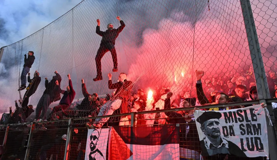 Bosnia-Herzegovina's fans celebrate qualifying for the FIFA World Cup 2026 after winning the European qualification final football match against Italy at the Bilino-Polje stadium in Zenica on March 31, 2026. (Photo by Elvis BARUKCIC/AFP)