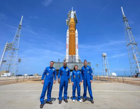 This NASA handout image shows NASA astronauts Reid Wiseman, Artemis II commander (L), Victor Glover, Artemis II pilot (2L), Christina Koch, Artemis II mission specialist (2R), and CSA (Canadian Space Agency) astronaut Jeremy Hansen, Artemis II mission specialist (R), as they stop for a group photo during a visit to NASA?s Artemis II SLS (Space Launch System) rocket and Orion spacecraft, on March 30, 2026, at Launch Complex 39B of NASA?s Kennedy Space Center in Florida. NASA began its two-day countdown on March 30 ahead of what is slated to be its first crewed moonshot in more than half a century, a long-anticipated loop around Earth's satellite that is to pave the way for future exploration. The first window to launch from the Kennedy Space Center in Florida opens Wednesday, April 1 at 6:24 pm (2224 GMT), and NASA officials said the countdown began at 4:44 pm. (Photo by Bill INGALLS/NASA/AFP)/RESTRICTED TO EDITORIAL USE - MANDATORY CREDIT "AFP PHOTO/NASA/Bill INGALLS" - HANDOUT - NO MARKETING NO ADVERTISING CAMPAIGNS - DISTRIBUTED AS A SERVICE TO CLIENTS