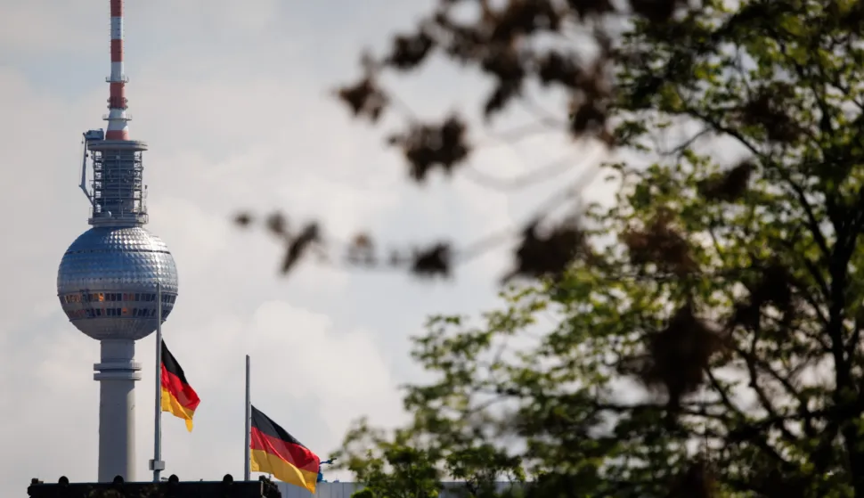 epa12046291 German national flags fly at half-mast at the Reichstag building, the seat of the German parliament, in front of the Berlin TV tower in Berlin, Germany, 22 April 2025. Pope Francis died on 21 April 2025 at the age of 88, according to the Holy See. Born Jorge Mario Bergoglio in Buenos Aires, Argentina, on 17 December 1936, he was appointed leader of the Catholic Church on 13 March 2013, succeeding Pontiff Emeritus Benedict XVI. EPA/CLEMENS BILAN