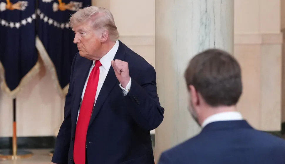 US Vice President JD Vance watches as US President Donald Trump gestures after speaking at a televised address on the conflict in the Middle East from the Cross Hall of the White House in Washington, DC on April 1, 2026. (Photo by Alex Brandon/POOL/AFP)