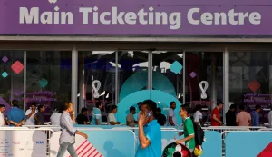 (FILES) Football fans line up outside the Main Ticketing Centre to try to get match tickets on November 18, 2022 in Doha, Qatar, ahead of the Qatar 2022 World Cup football tournament. The Football Supporters Europe (FSE) group filed a lawsuit on March 24, 2026, with the European Commission against football's world governing body FIFA over "excessive ticket prices" for this year's World Cup finals. (Photo by David GANNON/AFP)