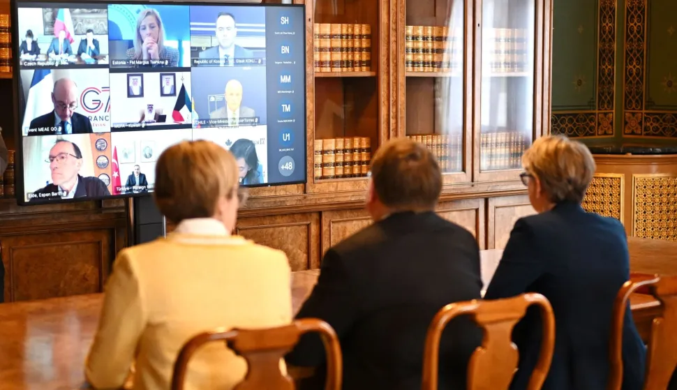 Britain's Foreign Secretary Yvette Cooper (R) hosts a virtual summit at the Foreign & Commonwealth Office in London on April 2, 2026. British Foreign Minister Yvette Cooper stressed on April 2, the "urgent need" to reopen the Strait of Hormuz as she convened a meeting of more than 40 countries on the vital shipping route. (Photo by Leon Neal/POOL/AFP)