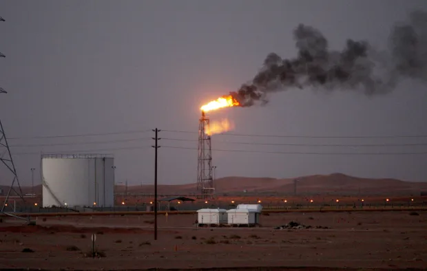 epa07841156 (FILE) - A gas flame behind pipelines in the desert at Khurais oil field, about 160 km from Riyadh, Kingdom of Saudi Arabia, 23 June 2008 (reissued 14 September 2019). According to Saudi state-owned oil company Aramco, two of its oil facilities in Saudi Arabia, Khurais and Abqaiq, were set on fire after allegedly having been targeted by drone attacks. EPA/ALI HAIDER *** Local Caption *** 55191226