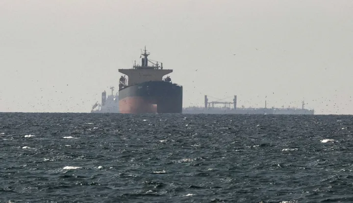 Cargo ships in the Gulf, near the Strait of Hormuz, as seen from northern Ras al-Khaimah, near the border with Oman's Musandam governance, amid the U.S.-Israeli conflict with Iran, in United Arab Emirates, March 11, 2026. REUTERS/Stringer REFILE - CORRECTING "TANKERS" TO "CARGO SHIPS" AND REMOVING ACTION "SAIL". Photo: STRINGER/REUTERS