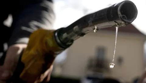TOPSHOT - Drops of petrol fall from the nozzle of a petrol pump at a gas station in Mulhouse, eastern France, on April 1, 2026, as US-Israel war on Iran, launched on February 28, has roiled global energy and equities markets, sending oil prices skyrocketing after Tehran virtually closed the key Strait of Hormuz. (Photo by SEBASTIEN BOZON/AFP)
