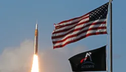 TOPSHOT - The Artemis II crewed lunar mission launches at Kennedy Space Center in Cape Canaveral, Florida, on April 1, 2026. Four astronauts blasted off aboard a massive NASA rocket April 1 on a long-anticipated journey around the Moon, the first crewed lunar flyby in more than 50 years. With an intense roar that reverberated far beyond the launchpad, the enormous orange-and-white rocket carried three Americans and one Canadian away from Florida's Kennedy Space Center at approximately 6:35 pm local time, according to an AFP journalist onsite. "We're going to the Moon!" yelled a spectator. (Photo by Gregg Newton/AFP)